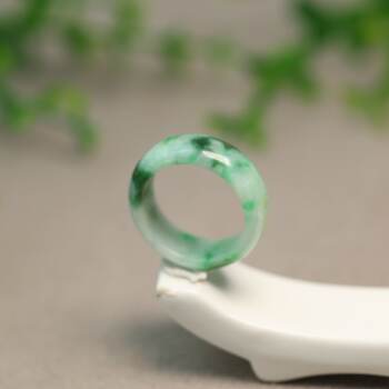 Spicy green burmese natural grade a jadeite ring on white background