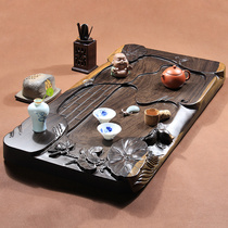 Whole log ebony tea tray Solid wood tea table Kung Fu tea set Household tea sea drainage type carved