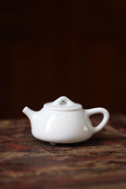 In the early 90 years the Dehua kiln white porcelain pot teapot pure white stone laden pot bubble Puer rock tea old tea ware