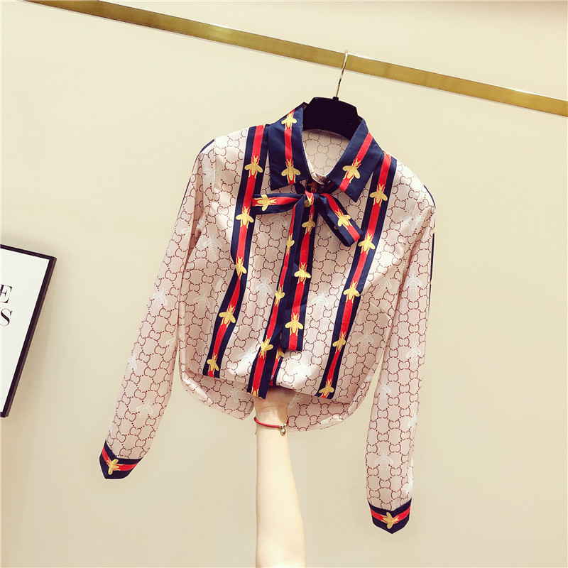 South Korean snow spinning butterfly knot shirt female design sensation 2022 new spring and autumn long sleeve foreign style fashion shirt tide