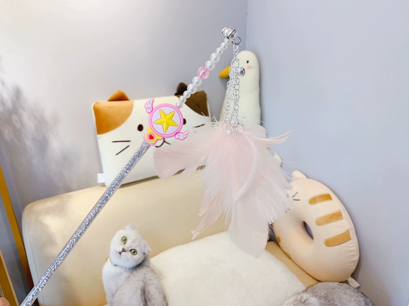 Minnesota Pink Feather Funny Cat Wand Thủy thủ Mặt trăng Magic Wand Cat Little Kitten Đồ chơi tương tác - Mèo / Chó Đồ chơi