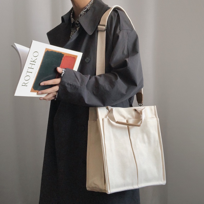 KAFKAsSHOP messenger bag black and white canvas handbag men and women street shooting large-capacity one-shoulder personality messenger bag tide