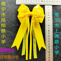Nanning Fengxiang Democracy Xinghu Primary School yellow beige burgundy bow hair accessories School style School uniform wearing hairpin