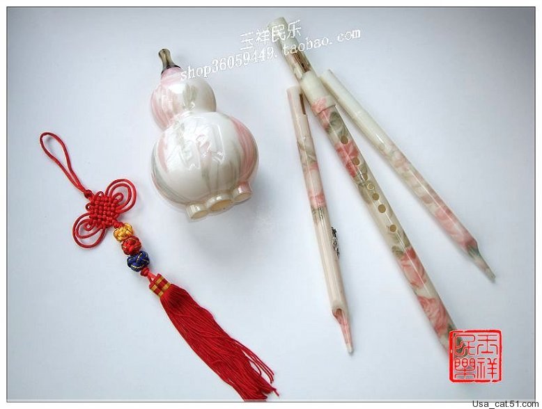 Màu hồng nhạt ★ chống ăn mòn mạnh mẽ ★ 傣 胶 bakelite có thể tháo rời hai giai điệu dưa chuột ★ độc quyền nhạc cụ quốc gia giá sáo trúc