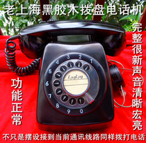 The old Shanghai pure black dial disc magnet telephone receives the current communication line with a sound clear macro