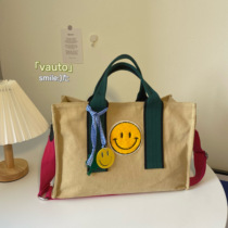 2021 new Korean small crowddesign smiley face sails cloth bag spelled towel embroidered single shoulder large capacity hand inclined cross-pack
