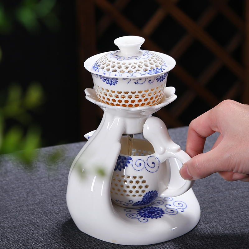 Friends is a complete set of automatic water and exquisite blue and white hollow out tea set suits for against hot insulation teapot