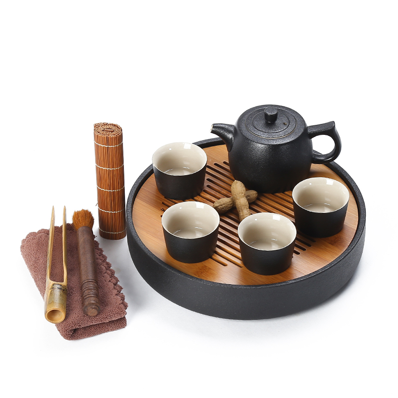 Black pottery tea tray ceramic portable travel bag of a complete set of kung fu tea set suit Japanese household dry teapot teacup