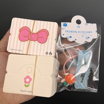 About a hundred live broadcast room hair accessories folded in half cardboard tag packaging small flower bow snowflake English version