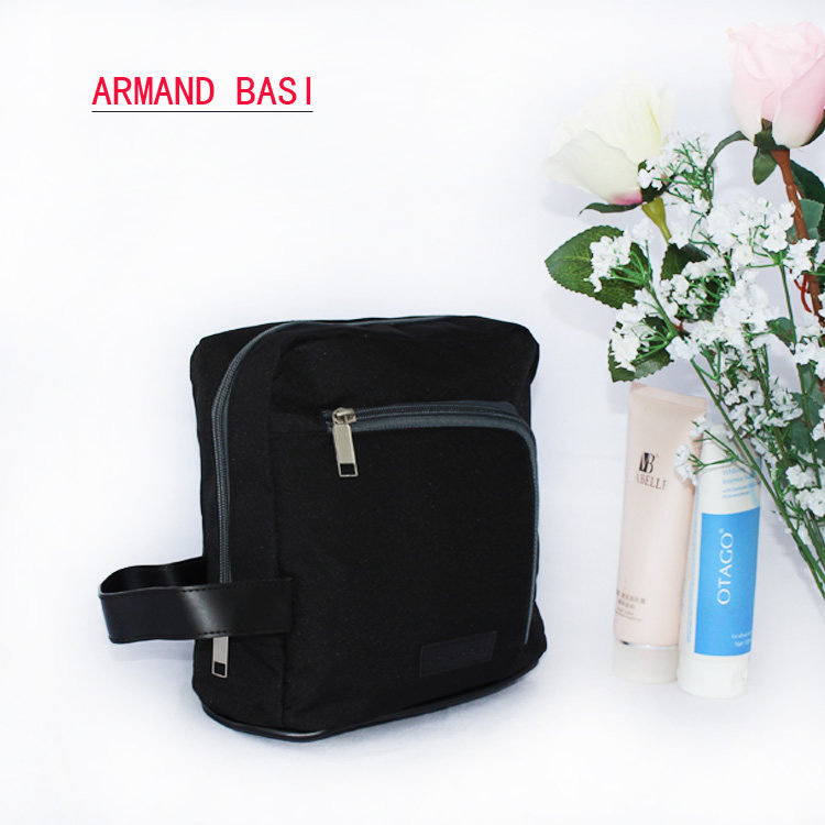 Pure black waterproof cosmetic bag hand bag Men and women carry-on storage bag ID bag Wash bag Europe and the United States popular bag