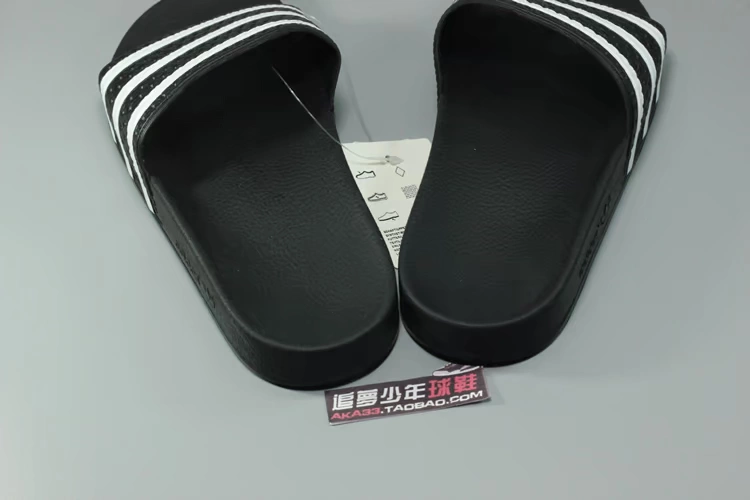 ADIDAS clover ADILETTE sọc đen và trắng thể thao bãi biển cuộc sống 280647 AP9971 - Dép thể thao