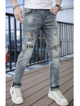 2010 Spring Summer High-end Embroidery Breaking Cave Jeans Mens Spring Autumn New Elastic Body Small Foot Pants Korean Version Trend