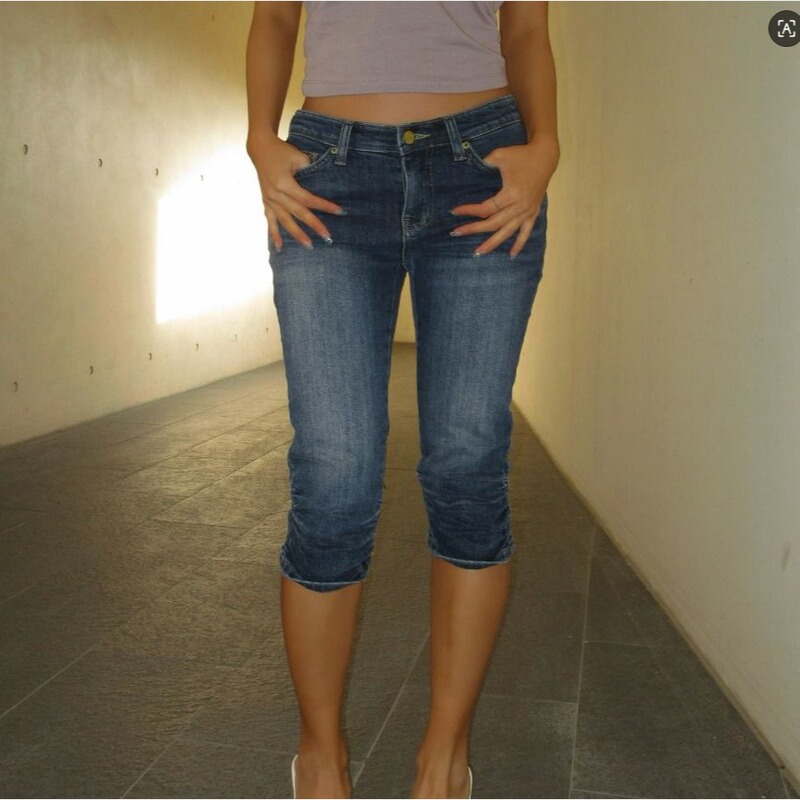 Slim-Fit Low-Waist Denim Shorts with Pleated Hems and Knee-Length Cut Slim-Fit Low-Waist Denim Shorts with Pleated Hems and Knee-Length Cut