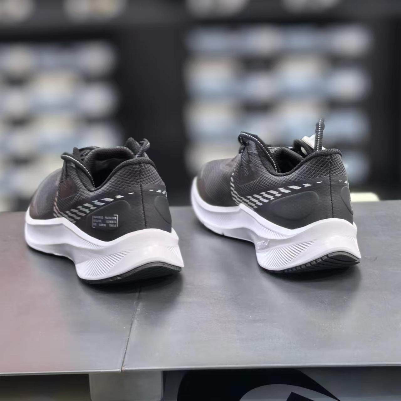 nike running quest 3 shield trainers in black