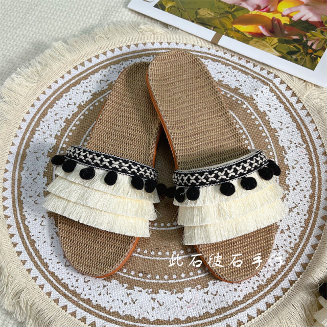 This Shipi stone is hand-made 2022 summer beach casual flat-bottomed flat-heeled linen straw slippers tassel fur sneakers