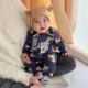 Темно-синий с принтом маленьких львов по всей поверхности.