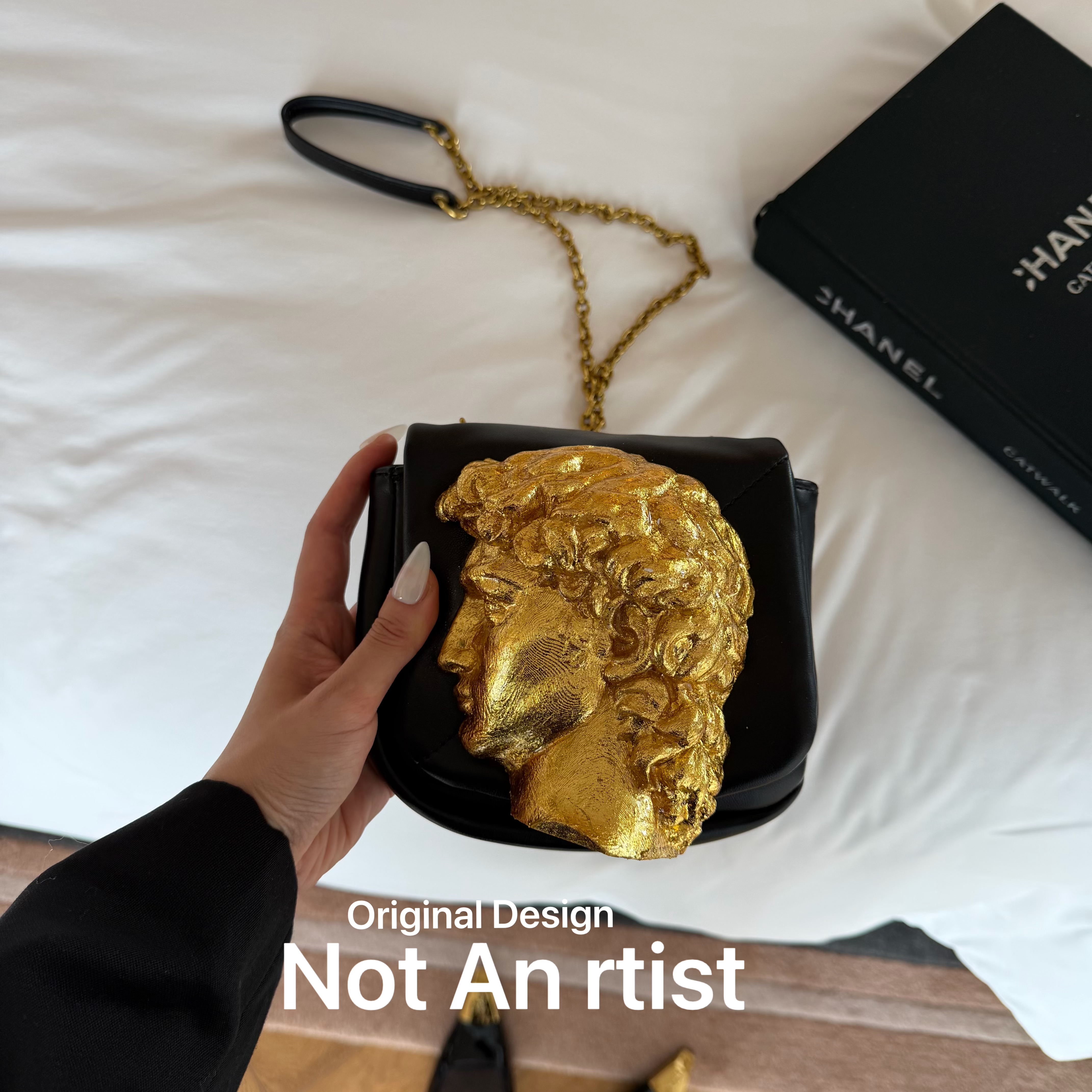 Original Michelangelo's masterpiece David head sculpture, black and gold contrasting aesthetics, niche art crossbody bag.