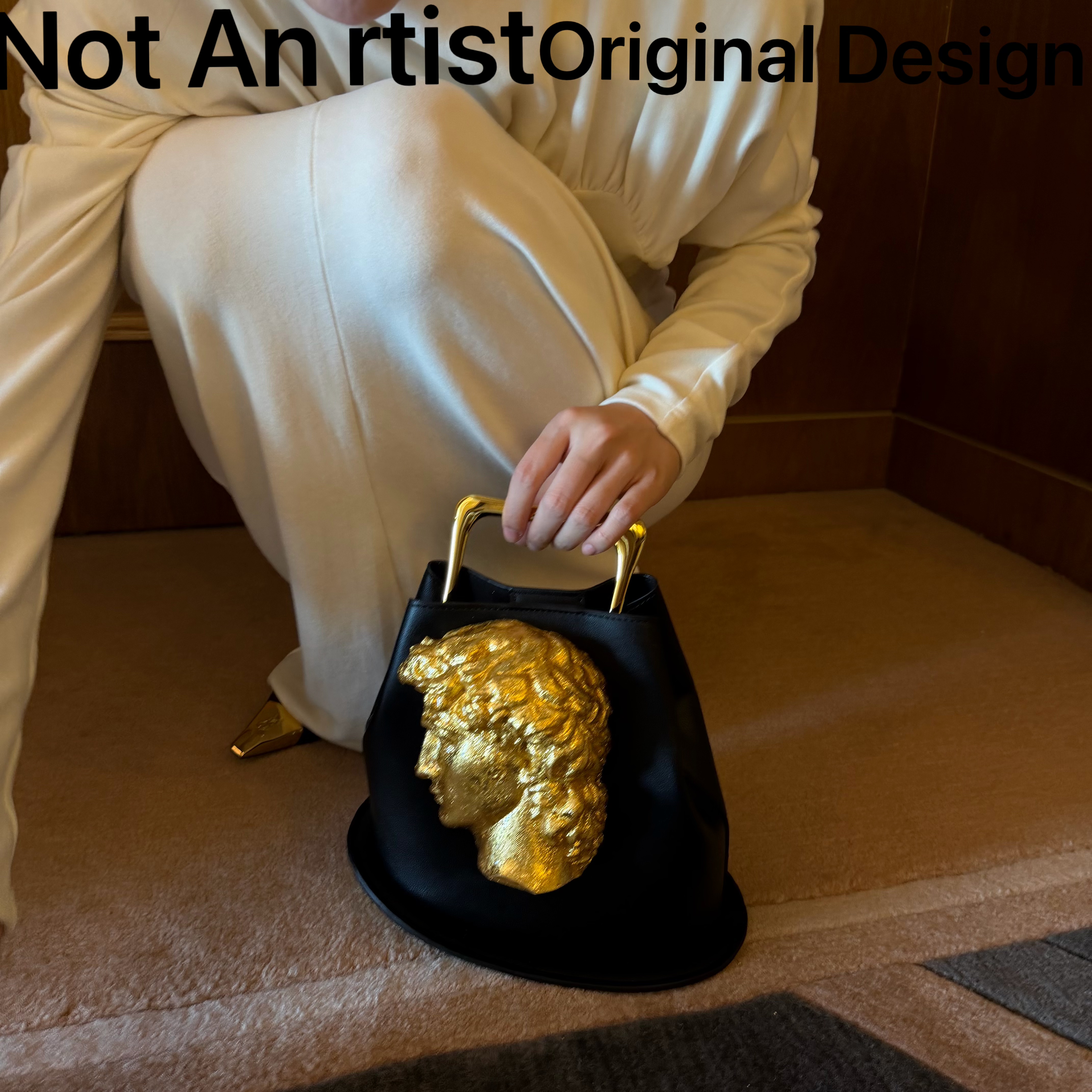 Original design David head relief handbag, artistic high-end black and gold bucket bag, niche sculptural clutch.