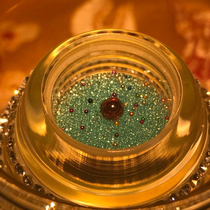 A bottle of Shakyamunis green solid son can be used to hold the stupa gaw box