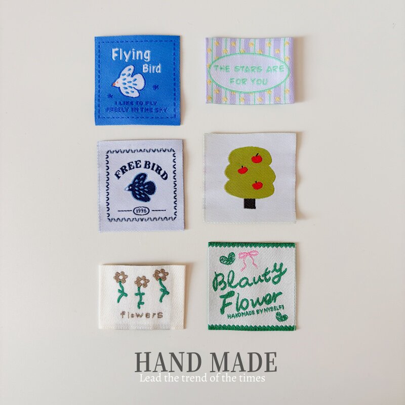 鳥をモチーフにした服飾ラベル、韓国風、汎用性が高く、DIY手作り布製ラベル、服の首元ラベル、バッグの布製パッチ、アパレル織りラベル。