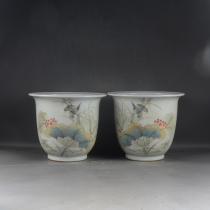 A pair of hand-painted light crimson colored lotus leaf breeze flower and bird pattern flowerpots from the Republic of China a pair of fine ceramic ornaments from Jingdezhen factory