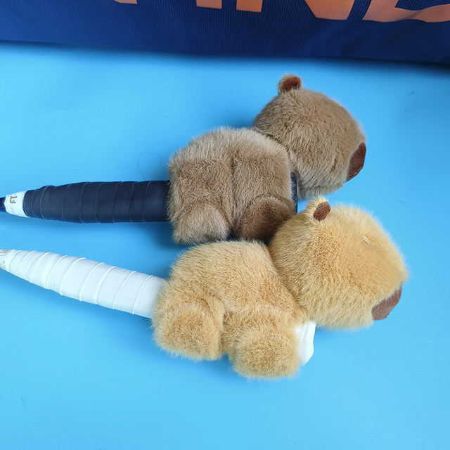 Creative Cartoon Plush Capibara Badminton Racket Grip Decoration Doll Tennis Racket Doll ຂອງຂວັນຄູ່ຜົວເມຍ