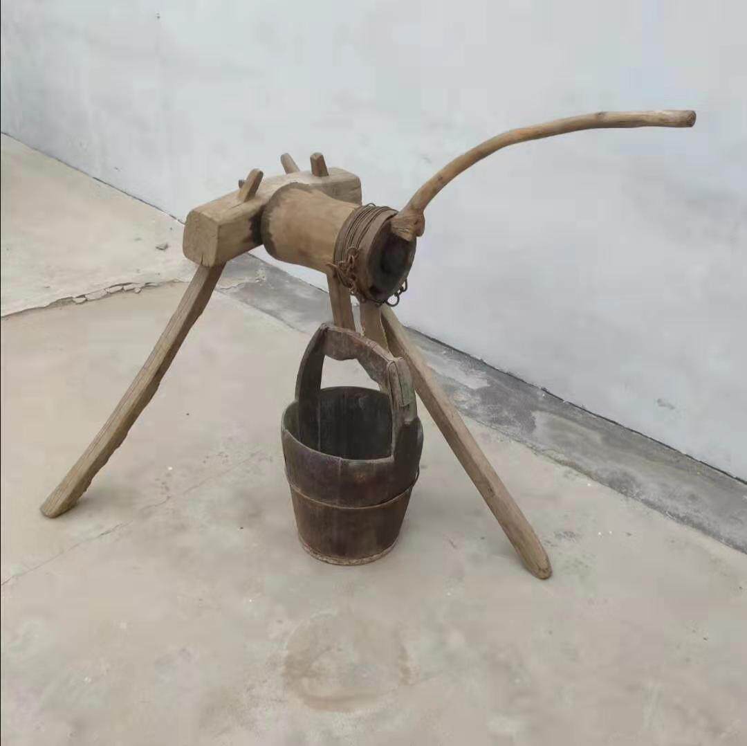 Folklore old objects nostalgic collection The old collection of the old fashioned water machine The old fashioned water machine old farmhouse tourist with tourist scenic area swing piece