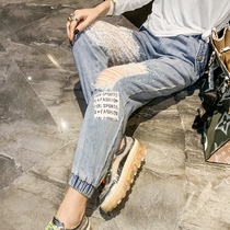 Jeans women 2021 Autumn New European station heavy industry hot drill thin elastic waist stitching lace hollow trousers