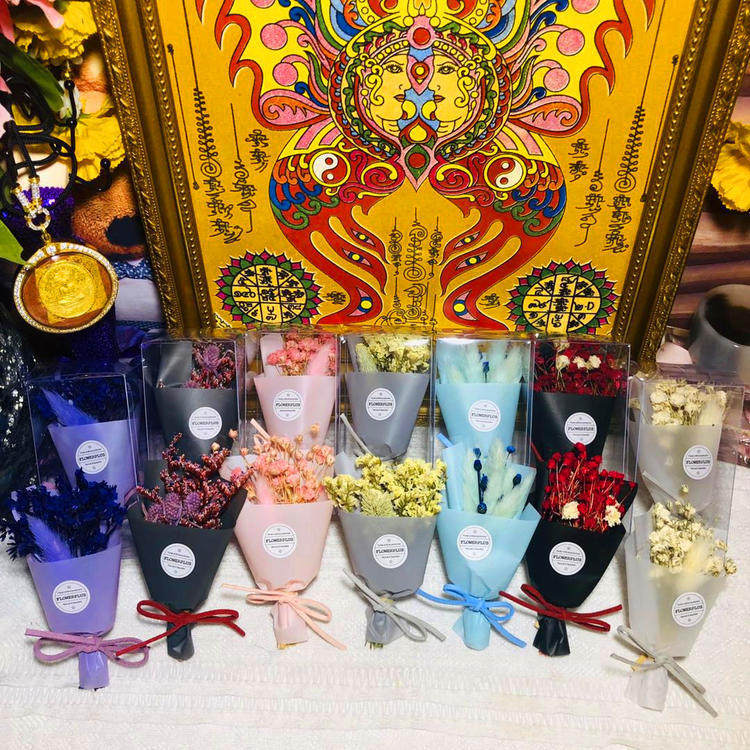 Thai Buddhist Buddha statue dedicated to evergreen flowers never withered florist bouquet to hold flowers lavender orchid with packaging