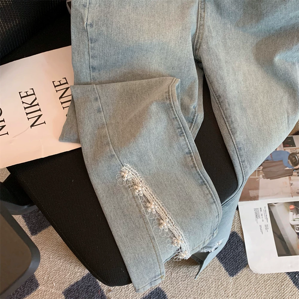 Женские джинсы с заниженной талией и расклешенной бахромой вSpring-Summer, с фронтальным разрезом, крупной стежкой и необработанными краями, обтяжка и эластичность