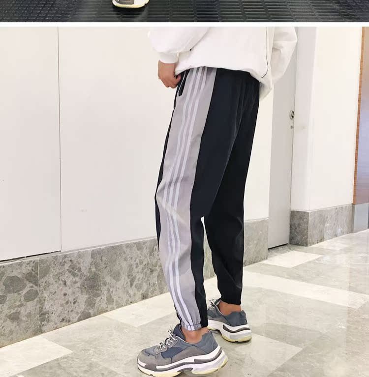 Quần tây nam phong cách mùa thu 2018 mới quần skinny trơn xu hướng phiên bản Hàn Quốc của quần hip hop phản quang quần đùi