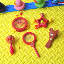 Babys hand rattles the bell and surges the baby with a small sand hammer newborn gripping toy for 0-3-6-12 months