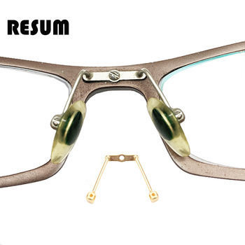 Saddle integrated metal nose pad bracket and one-piece support rod
