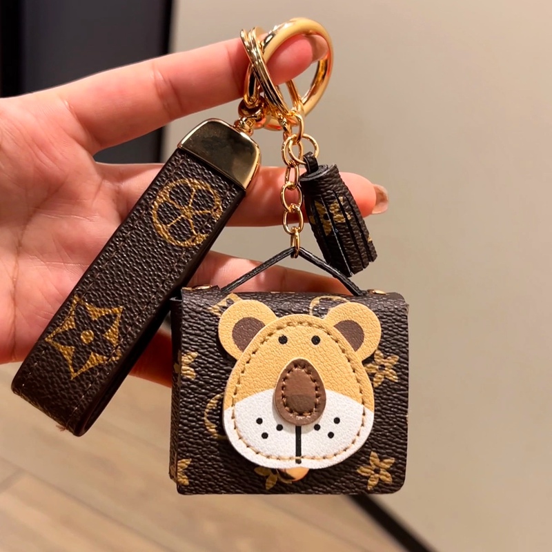 Suitable for Lv Bag Trendy Brand Presbyopic Lion Bluetooth Headset Cosmetics Bag Creative Coin Purse Car Key Pendant Gift