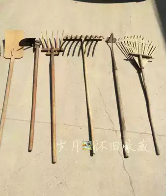 Folk old objects nostalgic farming collection old farm tools old wooden Harrow wooden fork iron hoe film and television props farmyard ornaments
