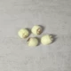 Одно семя лотоса размером 2*1,5 см.