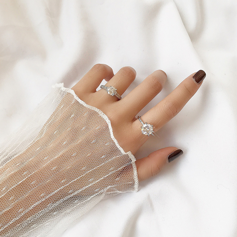 diamond ring in index finger