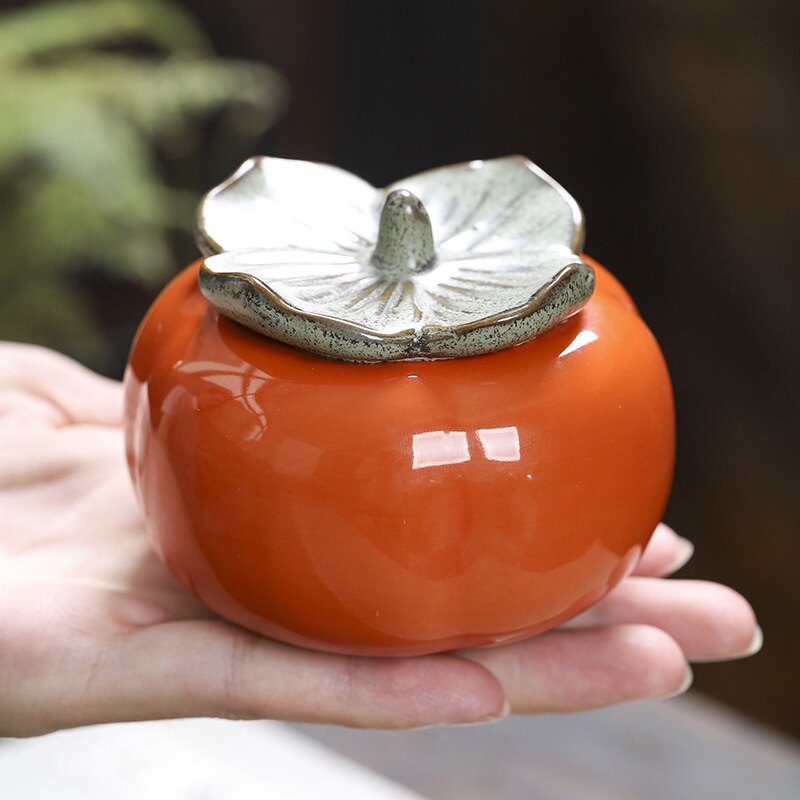 Creative persimmon tea pot small sealed pot decoration portable tea pot ceramic storage pot Ruyi persimmon persimmon Ruyi pot - Taobao