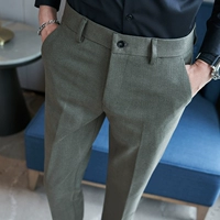 Темно -зеленые брюки