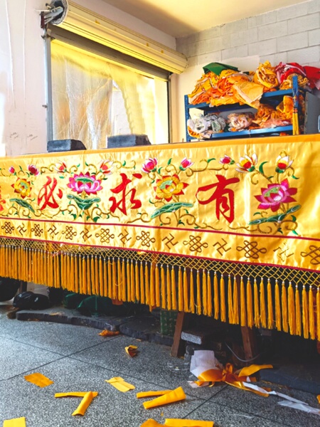 Buddhist Temple Decorations, Embroidered Lotus Flowers, Horizontal Banners with "Your Requests Will Be Answered," Horizontal Colored Door Lintels, Banners with "Buddha's Light Shines Everywhere," Door Curtains and Drapes in Front of the Buddha