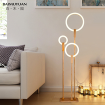 Nordic floor lamp living room Japanese personality circle ins Wind Net Red simple bedroom study solid wood vertical table lamp
