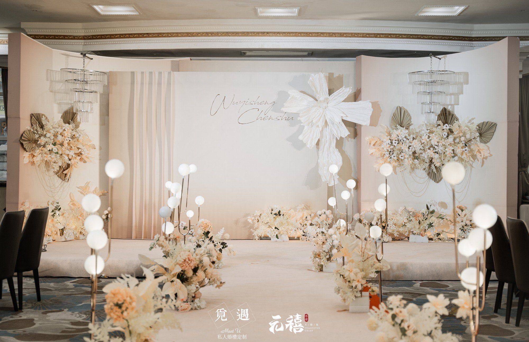 Minimalist wedding ceremony setup with simple chairs, a clean backdrop, and no cluttered decorations