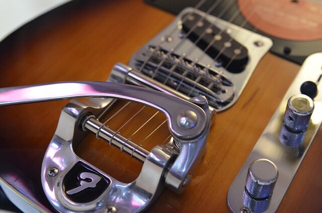 does guitar center restring guitars