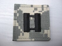The rank of captain of the embroidery badge (ACU)
