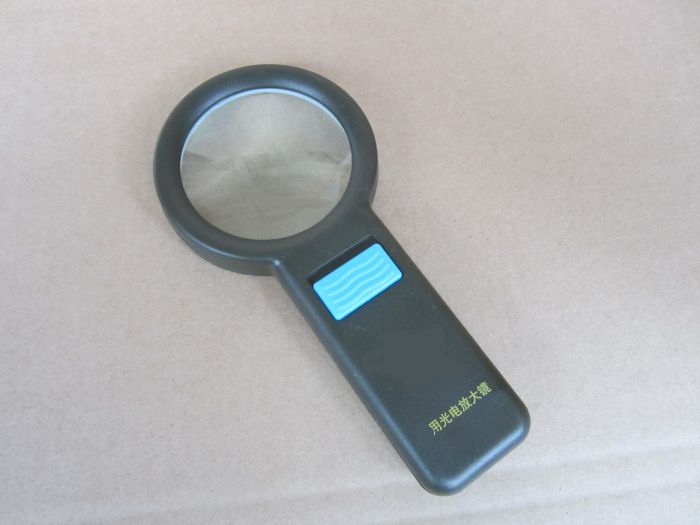 Optoelectronics magnifier with LED lamp magnifier older people look at newspaper supplies