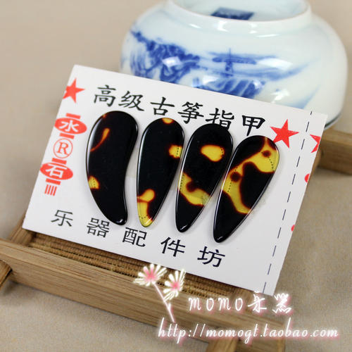 Beginners practice using the larger number in the small number of guzheng nails