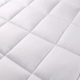Khách sạn giường nệm pad là phụ 1.2m1.5m1.8m có lớp đệm bông nệm pad bán buôn bảo vệ chống trượt - Nệm