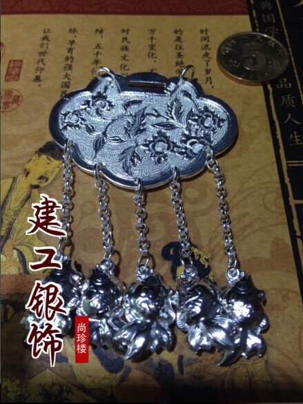 The baby is a year old wearing a handmade chisel-patterned card shoe-sheet