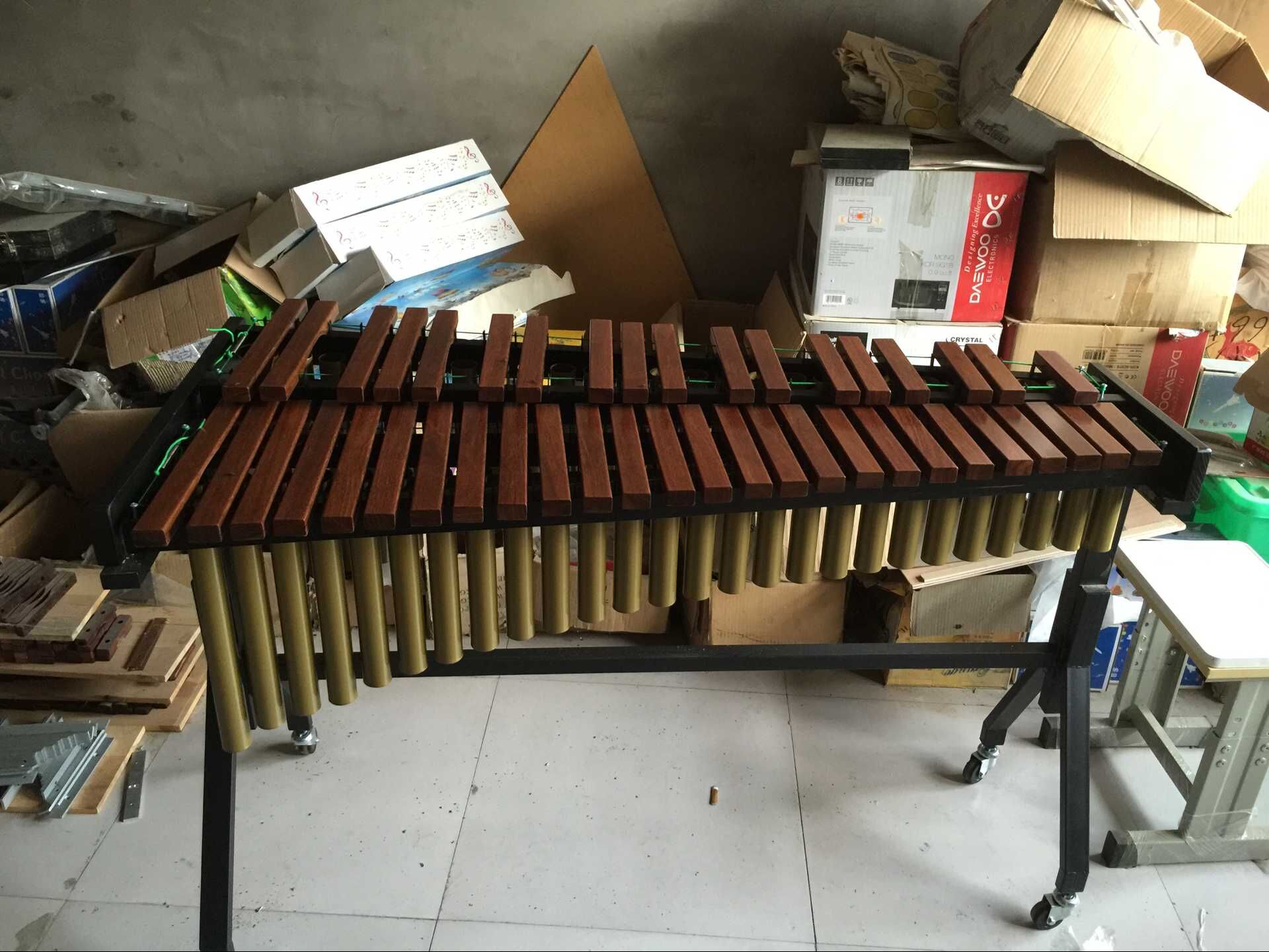 32 key -61 key Malinba red wood xyloist student practice with a test exam with a professional playing percussion instrument