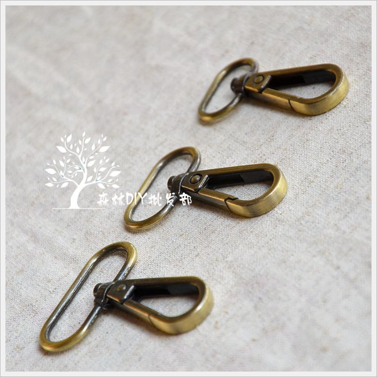 Forest wholesale] day single inner diameter 20 25 32MM upscale green ancient sweep alloy dog with baby holding baby bag button 50 packets